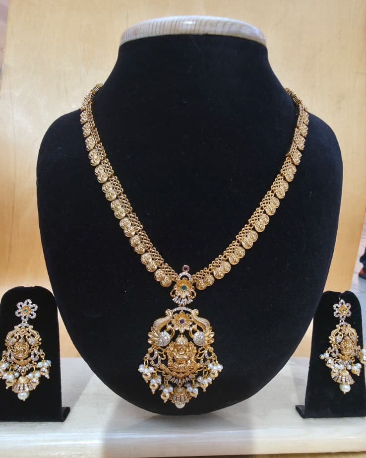 Gold-toned Nagas AD Kemp Peacock Haaram set