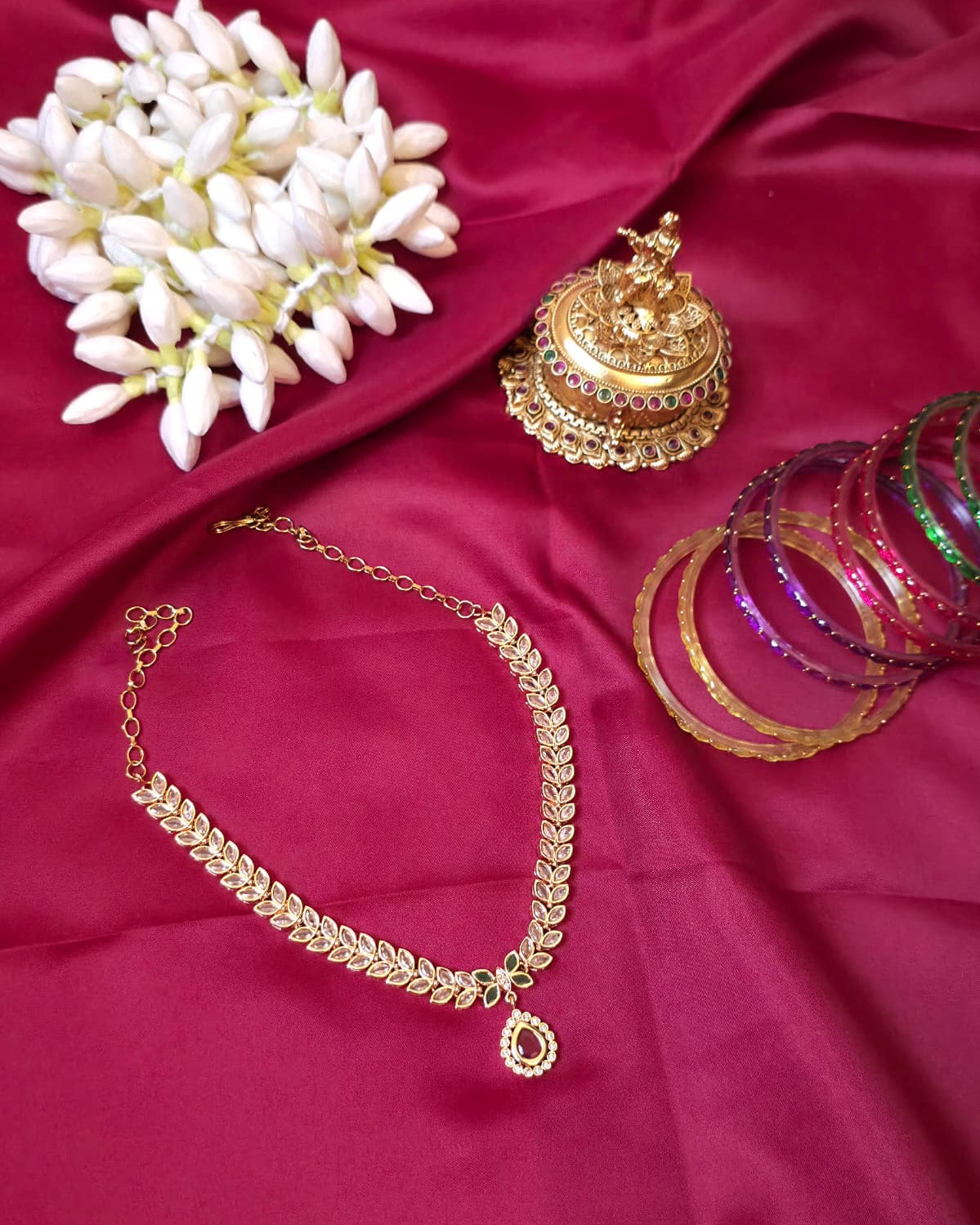 Kundan Leaf Necklace Set with Green Stone Pendant