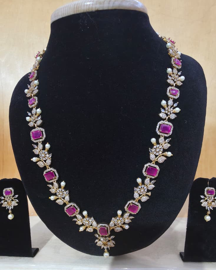 Gold-plated ruby and cubic zirconia floral necklace set with matching earrings