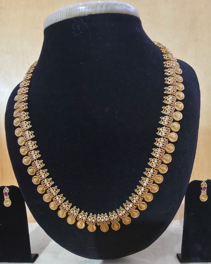 Gold-polished traditional Indian coin necklace set with ruby and white stone embellishments
